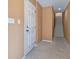 Unfinished basement with a white door and staircase at 509 Vincinda Crest Way, Tampa, FL 33619