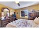Bedroom with dark wood furnishings and a large window at 5201 Pless Rd, Plant City, FL 33565