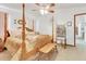 Bedroom featuring a four-poster bed, ceiling fan, and a birdcage at 5201 Pless Rd, Plant City, FL 33565