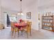 Dining room featuring a wooden table with seating for six and a built-in bookcase at 5201 Pless Rd, Plant City, FL 33565