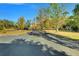 Long driveway leading to a house with a basketball hoop at 5201 Pless Rd, Plant City, FL 33565