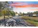 Home exterior with covered carport and beautiful sunset view at 5201 Pless Rd, Plant City, FL 33565