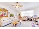 Inviting living area with plush sofas, an aquarium, and natural light from large windows at 5201 Pless Rd, Plant City, FL 33565