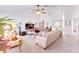 Cozy living room with a ceiling fan, comfortable seating, and an entertainment center at 5201 Pless Rd, Plant City, FL 33565