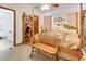 Spacious primary bedroom with wooden furniture and ensuite bathroom at 5201 Pless Rd, Plant City, FL 33565