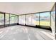 Bright, enclosed sunroom with large windows overlooking the backyard at 5201 Pless Rd, Plant City, FL 33565