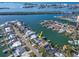 An aerial view showcases the home's waterfront location at 54 Midway Is, Clearwater Beach, FL 33767