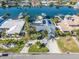 Aerial view of house, pool, and boat dock at 54 Midway Is, Clearwater Beach, FL 33767