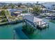 Covered boat dock with lift on a canal at 54 Midway Is, Clearwater Beach, FL 33767