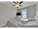 Bright bedroom with a queen bed, window, and ceiling fan at 5508 Rainwood Meadows Dr, Apollo Beach, FL 33572