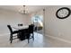 Dining area with marble table and access to backyard at 5508 Rainwood Meadows Dr, Apollo Beach, FL 33572