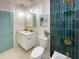 Stylish bathroom with floating vanity, bathtub and gold fixtures at 5516 Golden Dr, Tampa, FL 33634
