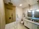 Modern bathroom with double vanity, frameless shower, and stylish fixtures at 5516 Golden Dr, Tampa, FL 33634