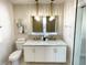 Modern bathroom with double vanity, gold fixtures, and a window at 5516 Golden Dr, Tampa, FL 33634