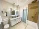 Modern bathroom with double vanity, large shower, and stylish fixtures at 5516 Golden Dr, Tampa, FL 33634