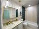 Elegant bathroom with double vanity, bathtub, and teal tile at 5516 Golden Dr, Tampa, FL 33634