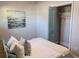 Guest bedroom with queen bed and teal accents at 5516 Golden Dr, Tampa, FL 33634