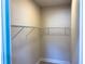 Large walk-in closet with wire shelving and hanging rods at 5516 Golden Dr, Tampa, FL 33634