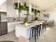 Modern kitchen with island, stainless steel appliances, and white cabinetry at 5516 Golden Dr, Tampa, FL 33634