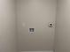 Small laundry room with hookups for washer and dryer at 5516 Golden Dr, Tampa, FL 33634