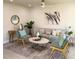 Bright and airy living room featuring a beige sofa, teal accents, and a stylish coffee table at 5516 Golden Dr, Tampa, FL 33634