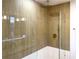 Modern shower with glass enclosure and gold fixtures at 5516 Golden Dr, Tampa, FL 33634