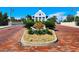 Attractive brick-paved entrance to Little Harbor, featuring landscaping and a charming building at 611 Destiny Dr # 207, Ruskin, FL 33570