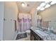 Clean bathroom with a shower/tub combo and granite vanity at 6337 Waves End Pl, Apollo Beach, FL 33572