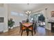 Bright dining room with wood table and chairs, leading to a patio at 6337 Waves End Pl, Apollo Beach, FL 33572