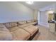 Spacious living room with a sectional sofa and access to other rooms at 6337 Waves End Pl, Apollo Beach, FL 33572