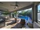 Inviting pool area with covered patio and seating at 6337 Waves End Pl, Apollo Beach, FL 33572
