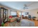 Bright living room featuring a comfortable seating area and hardwood floors at 709 W Brockton Pl, Sun City Center, FL 33573