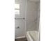 Renovated bathroom, marble-tiled shower/tub combo at 7805 Ridein Rd, Tampa, FL 33619