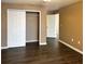 Spacious bedroom boasts wood floors, white doors and neutral paint, offering a serene retreat at 9107 Lingrove Rd, Weeki Wachee, FL 34613
