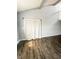 A bright bedroom featuring hardwood floors and a large window with natural light at 9107 Lingrove Rd, Weeki Wachee, FL 34613