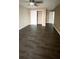 Bedroom featuring hardwood floors, neutral walls, and sliding door closet at 9107 Lingrove Rd, Weeki Wachee, FL 34613