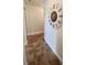 Neutral-toned hallway with tile flooring and large clock at 9950 62Nd N Ter # 316, St Petersburg, FL 33708