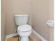Small bathroom with a toilet and tiled floor at 11240 Ragsdale Ct, New Port Richey, FL 34654