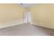 Bedroom with carpeted floor and door to hallway at 11240 Ragsdale Ct, New Port Richey, FL 34654