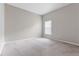 Simple bedroom with neutral walls and carpeted floor at 11240 Ragsdale Ct, New Port Richey, FL 34654