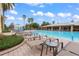 Relaxing pool area with lounge chairs and a view of the clubhouse at 11240 Ragsdale Ct, New Port Richey, FL 34654