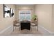 Modern dining room with a stylish table and chairs at 11240 Ragsdale Ct, New Port Richey, FL 34654