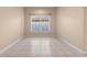 Bright dining room with tile flooring and large window at 11240 Ragsdale Ct, New Port Richey, FL 34654