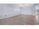 Bright dining room with light walls and wood-look flooring at 11240 Ragsdale Ct, New Port Richey, FL 34654