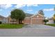 Charming single-story home featuring a well-maintained lawn and a two-car garage in a tranquil neighborhood at 11240 Ragsdale Ct, New Port Richey, FL 34654
