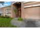 House entrance with double doors and a large pot of plant at 11240 Ragsdale Ct, New Port Richey, FL 34654