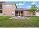 Two-story house with screened patio and grassy backyard at 11240 Ragsdale Ct, New Port Richey, FL 34654