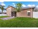Back exterior of house showing patio and yard at 11240 Ragsdale Ct, New Port Richey, FL 34654