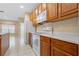 Well-equipped kitchen boasting wood cabinets and white appliances at 11240 Ragsdale Ct, New Port Richey, FL 34654