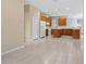 Bright and airy kitchen with wood cabinets and tiled flooring at 11240 Ragsdale Ct, New Port Richey, FL 34654